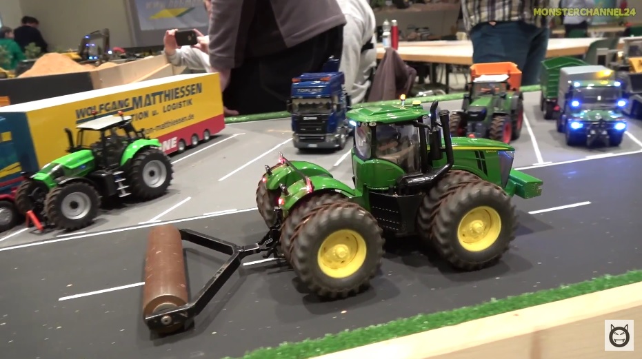 RC tractors, trucks and farming machines at work on a farm! John Deere